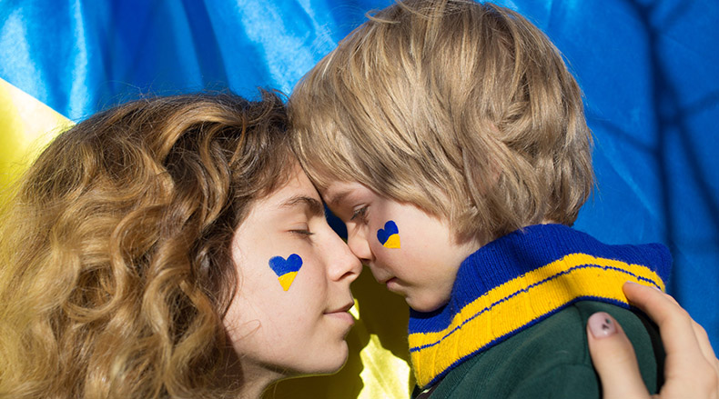 Adult and child with colors of Ukranian flag