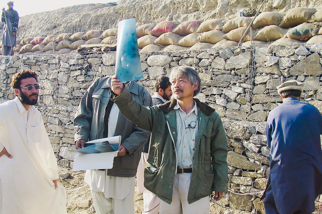 Tetsu Nakamura checking an X-ray at a canal construction site. Photograph courtesy of Peshawar-kai/PMS.