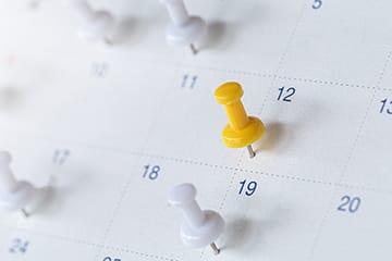 Calendar with pins on it