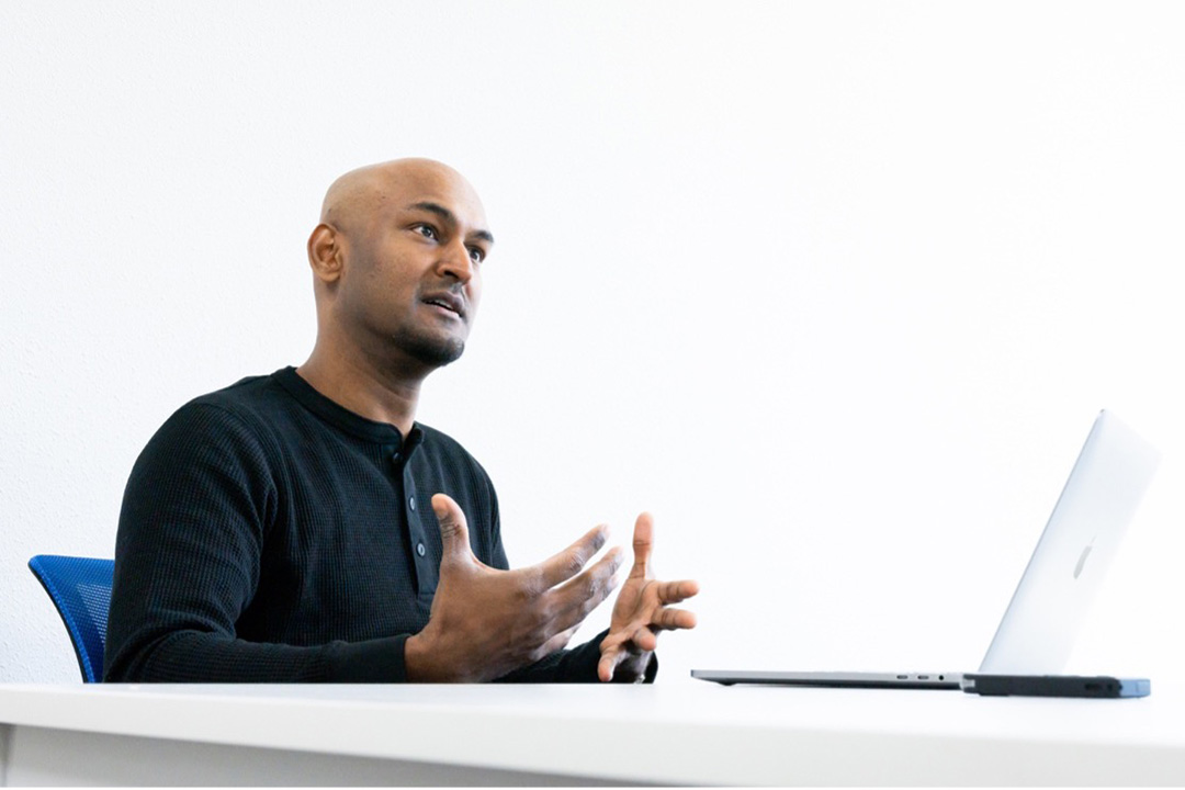 A person sitting in front of a computer